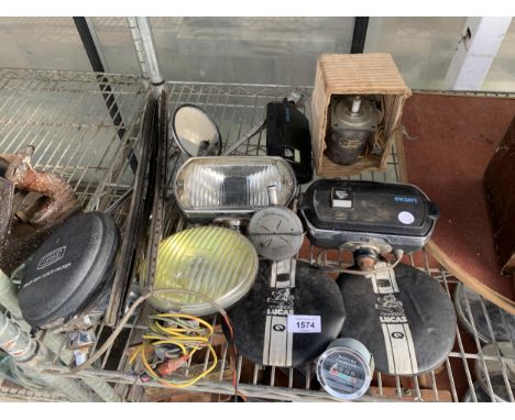 AN ASSORTMENT OF VINTAGE MOTOR SPARES TO INCLUDE HEADLAMPS, LUCAS LAMP COVERS, A MOTOR AND MIRRORS ETC
