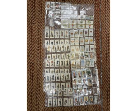 A COLLECTION OF VINTAGE CIGARETTE CARDS IN SLEEVES