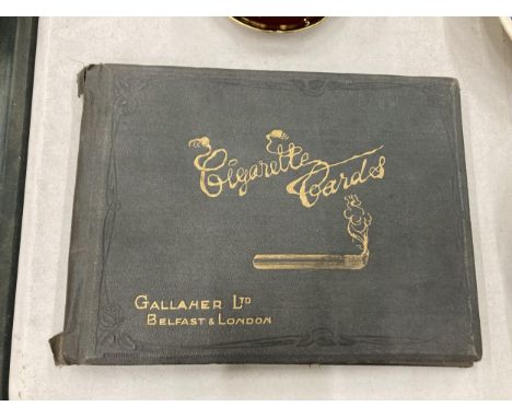 A VINTAGE CIGARETTE CARD ALBUM WITH CARDS