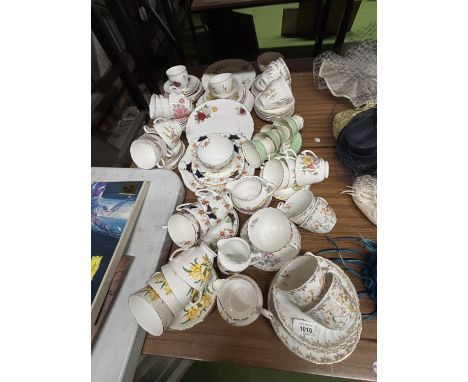 A LARGE QUANTITY OF TEACUPS, SAUCERS, SIDE PLATES, CAKE PLATES TO INCLUDE ROYAL ASCOT, ROYAL GRAFTON, PALISSY, ETC.,