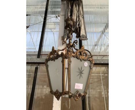 A DECORATIVE BRASS AND GLASS SECTIONAL CEILING LIGHT FITTING