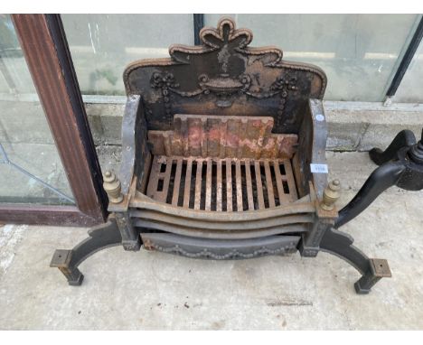 A VINTAGE CAST IRON FIRE GRATE WITH DECORATIVE BACK