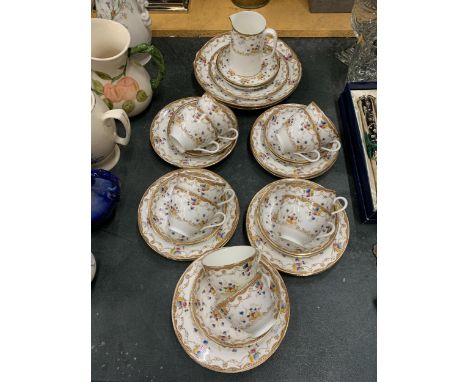 A PART TEA SET 'MADE IN ENGLAND' WITH DECORATIVE GOLD RIM AND FLOWER DECORATION TO INCLUDE TEACUPS, SAUCERS, SIDE/CAKE PLATES