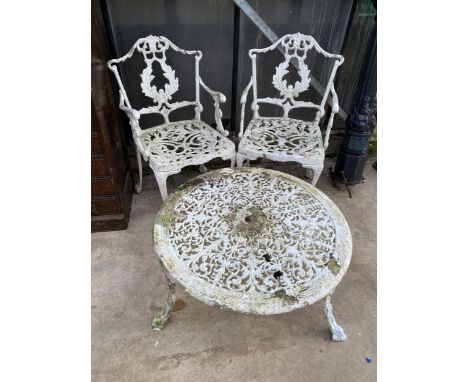 A VINTAGE CAST ALLOY BISTRO SET COMPRIOSING OF A ROUND COFFEE TABLE AND TWO CARVER CHAIRS