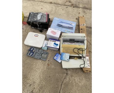 AN ASSORTMENT OF ITEMS TO INCLUDE A CANON SCANNER, A BROTHER TYPEWRITER AND A LABEL PRINTER ETC