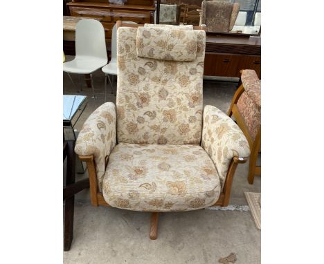 AN ERCOL BLONDE ELM UPHOLSTERED SWIVEL RECLINER CHAIR