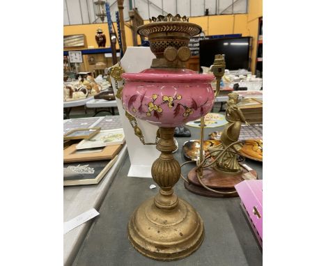 A VINTAGE CAST OIL LAMP WITH A PINK FLORAL RESERVOIR