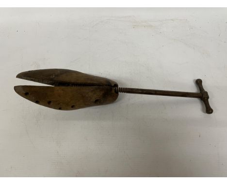 A VINTAGE WOODEN SHOE STRETCHER