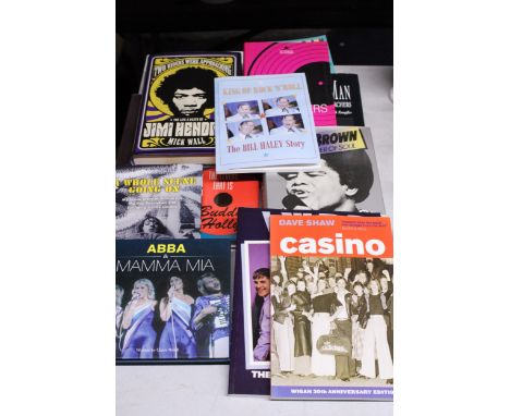 A COLLECTION OF MUSIC BOOKS TO INCLUDE NORTHERN SOUL, BUDDY HOLLY, ABBA, JAMES BROWN JIMI HENDRIX, ETC