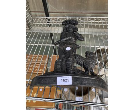 A DECORATIVE VINTAGE CAST IRON DOORSTOP OF A GENTLEMAN AND HIS DOG