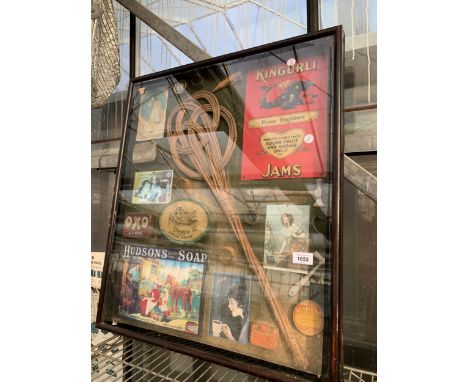 A VINTAGE FRAMED COLLAGE OF VARIOUS VINTAGE ITEMS TO INCLUDE BRANDED SIGNS, TOFFEE HAMMERS AND TINS ETC