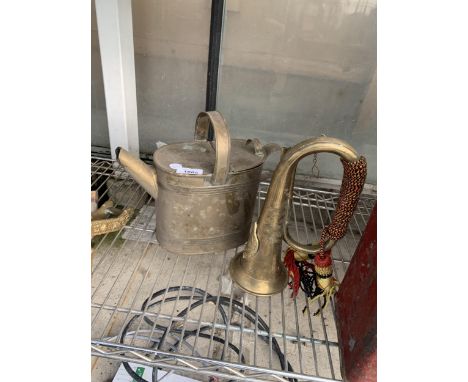 A VINTAGE BRASS HORN AND A VINTAGE BRASS WATERING CAN