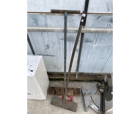 A VINTAGE GARDEN ROLLER AND A HEAVY METAL TAMP