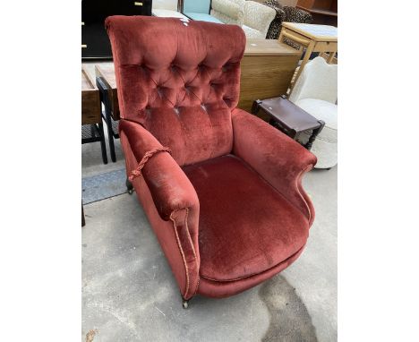 A VICTORIAN BUTTON BACK RECLINER CHAIR ON TURNED FRONT LEGS