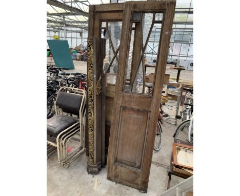 TWO VINTAGE WOODEN DOORS WITH GLAZED UPPER SECTIONS AND A DECORATIVE POST