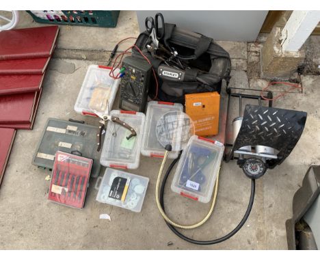 AN ASSORTMENT OF TOOLS AND HARDWARE TO INCLUDE A FOOT PUMP, WASHERS AND A VOLT TESTER ETC