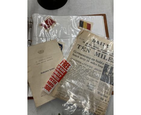A COLLECTION OF VINTAGE SILK FLAGS IN AN ALBUM