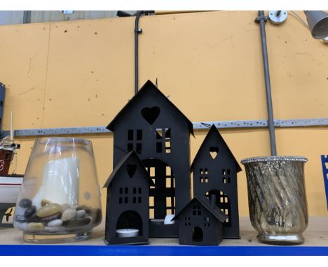 A COLLECTION OF CANDLE/TEA LIGHT HOLDERS TO INCLUDE GLASS VASE WITH PEBBLES, FOUR GRADUATED METAL TEALIGHT HOUSES ETC.