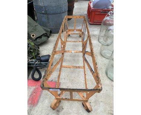 A METAL PLANT TROUGH HOLDER