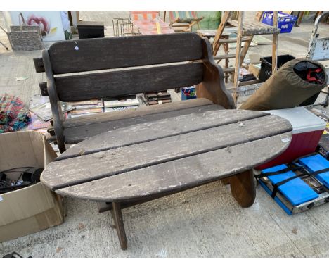 A TWO SEATER GARDEN BENCH AND TABLE BEARING THE LABEL MADE IN GENUINE WEST AFRICAN IROKO WOOD BY R.V. BRANSON RAMSBURY WILTS