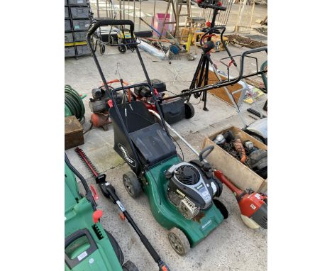 A QUALCAST PETROL LAWN MOWER WITH GRASS BOX AND BRIGGS AND STRATTON ENGINE
