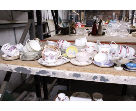 A LARGE QUANTITY OF CUPS SAUCERS AND SIDE PLATES TO INCLUDE ROYAL ALBERT, COLCLOUGH, ROYAL GRAFTON, MAYFAIR, ETC.,