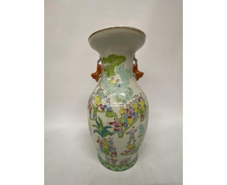 A LARGE CANTON STYLE BALUSTRADE VASE WITH FIGURAL SCENESE OF CHILDREN AND LION HANDLES - 37.5 CM