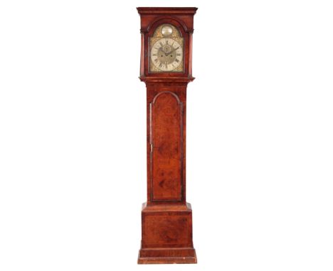 JOHN BERRY LONDON   A GEORGE I BURR WALNUT EIGHT-DAY LONGCASE CLOCK having a 12" arch top brass dial with mask head spandrels