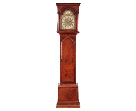 JOHN BERRY LONDON   A GEORGE I BURR WALNUT EIGHT-DAY LONGCASE CLOCK having a 12" arch top brass dial with mask head spandrels