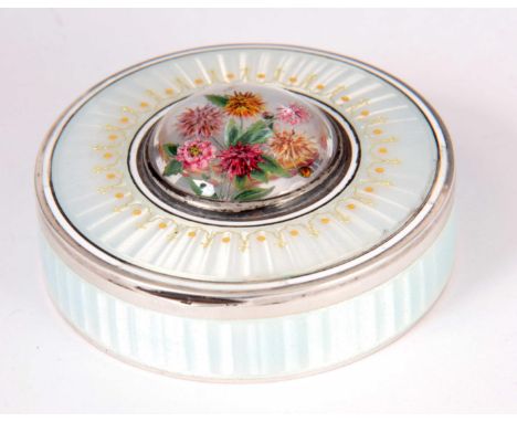 A 1920'S  ESSEX CRYSTAL SILVER AND PALE BLUE ENAMEL CIRCULAR BOX  with hinged lid having white enamelled borders and gilt dec