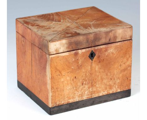A GEORGE III RECTANGULAR PEARWOOD AND EBONY VENEERED TEA CADDY having segmented hinged top revealing a silvered paper interio
