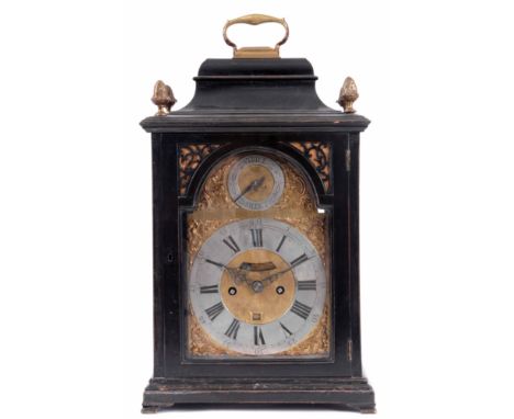 A GEORGE III EBONISED ENGLISH BRACKET CLOCK the case with bell top pediment surmounted by a brass hinged handle above glazed 