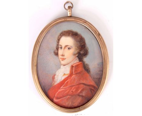 AN EARLY 19TH CENTURY MINIATURE PORTRAIT ON IVORY OF A YOUNG GENTLEMAN in a gilt metal oval frame - signed S Legros 10cm high