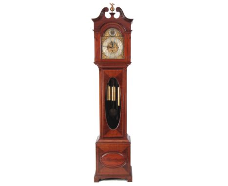 AN EDWARDIAN MAHOGANY CASED TUBE CHIMING LONGCASE CLOCK the swan neck pediment above a glazed door and canted corners on matc