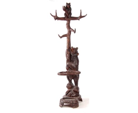 A GOOD 19TH CENTURY FINELY CARVED BLACK FORREST BEAR AND CUB HALL STAND with trunk stem and branch work top on a tray base an