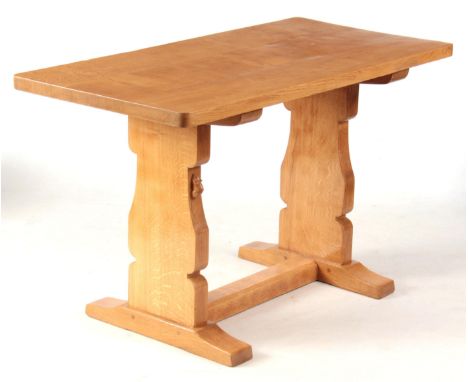 A ROBERT 'MOUSEMAN' THOMPSON OAK SIDE TABLE with rectangular top raised by side supports and joined by a bottom stretcher 122