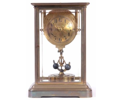 AN EARLY 20TH CENTURY 400 DAY FOUR GLASS MANTEL CLOCK the brass case inset with four bevelled glass panels enclosing a convex
