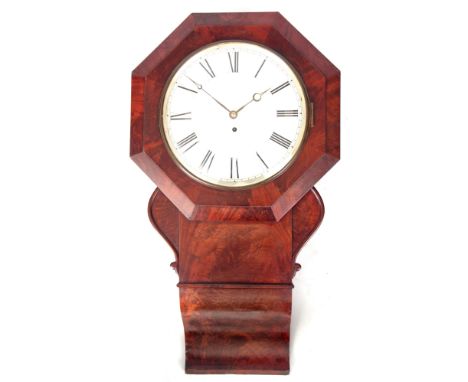A MID 19TH CENTURY FIGURED MAHOGANY DROP DIAL WALL CLOCK having an octagonal surround above a figured trunk flanked by scroll