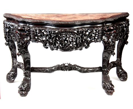 A FINE LARGE SIZED 19TH CENTURY CHINESE HARDWOOD CONSOLE TABLE of serpentine shape with veined marble inlaid top; above a fin