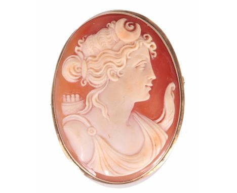 A 19TH CENTURY OVAL CARVED CAMEO PORTRAIT BROOCH depicting a bust portrait of a young lady with scrolled headdress - in plain