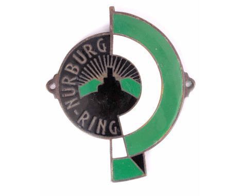 A MID 20TH CENTURY NURBURG RING ENAMEL CAR BADGE having black green and white enamel with image of Nurburg castle to centre 8