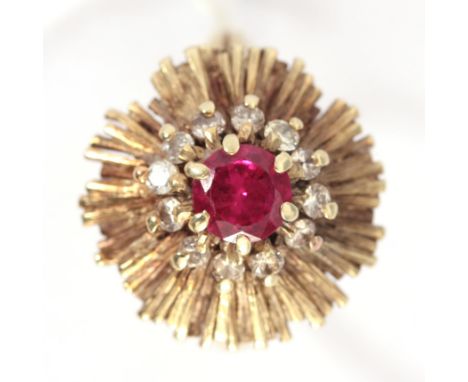 A 14K YELLOW GOLD RUBY AND DIAMOND RING 20mm diameter, app. 7.8g