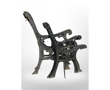 Two pairs of cast iron bench ends 