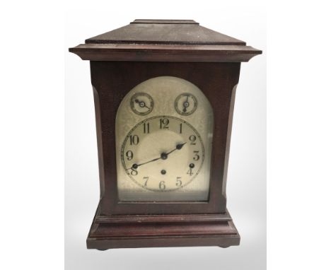 An Edwardian mahogany eight day chiming bracket clock with silvered dial, height 40cm, with pendulum and key.