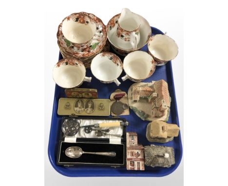 A group of Wellington Imari tea china, vintage tins, silver teaspoon in box, a further silver caddy spoon, cottage ornaments,