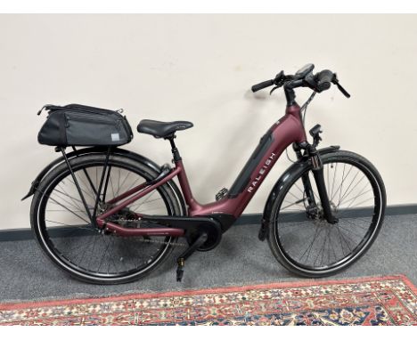 A Raleigh Motus Tour Bosch Active Line electric bike, instruction manual, bike lock with key, with spare motor (un-used), Bos