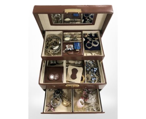 A multi-compartment jewellery box containing assorted costume jewellery, silver bangle and dress rings, stick pins, etc.
