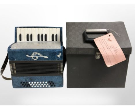 A Russian piano accordion in carry case.