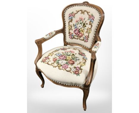 A Continental carved salon armchair in tapestry fabric 