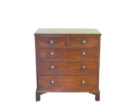 AN IRISH REGENCY MAHOGANY CHEST OF DRAWERS, the rectangular top above an arrangement of two short and three long graduated dr